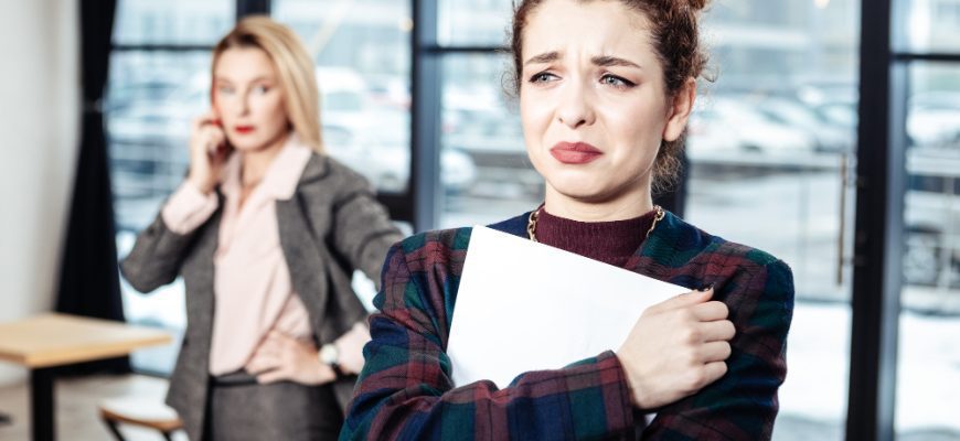 after job interview young accountant crying after job interview with strict businesswoman