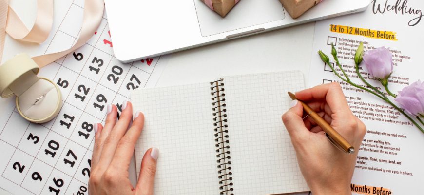 feminine hands writing notebook top view